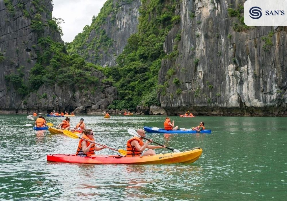 Tourists enjoy kayaking on the bay